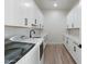 Bright laundry room with white cabinets and countertop at 2911 W Latona Rd # 1, Laveen, AZ 85339