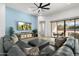 Spacious living room with comfortable seating, large TV, and sliding doors leading to the backyard at 2911 W Latona Rd # 1, Laveen, AZ 85339