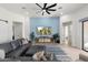 Spacious living room with sectional sofa, large TV, and ceiling fan at 2911 W Latona Rd # 1, Laveen, AZ 85339