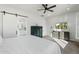 Main bedroom with king bed, built-in shelving and TV at 2911 W Latona Rd # 1, Laveen, AZ 85339