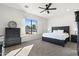 Main bedroom with a king-size bed, dresser, and ceiling fan at 2911 W Latona Rd # 1, Laveen, AZ 85339