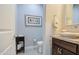 Small half bathroom with single vanity and toilet at 3941 E Iris Dr, Chandler, AZ 85286