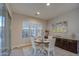 Bright dining area with a charming table for four, and access to the backyard at 3941 E Iris Dr, Chandler, AZ 85286