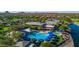 Resort-style pool with blue umbrellas and a large sundeck at 3971 N Daisy Dr, Florence, AZ 85132