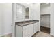 Bathroom with double vanity, granite countertop, and walk-in shower at 40055 W Venture Rd, Maricopa, AZ 85138