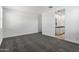Spacious bedroom with grey carpet and ensuite bathroom at 40055 W Venture Rd, Maricopa, AZ 85138
