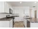 Modern kitchen with white cabinets and granite countertops at 40055 W Venture Rd, Maricopa, AZ 85138