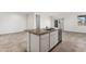 Kitchen island with granite countertop and stainless steel dishwasher at 40055 W Venture Rd, Maricopa, AZ 85138
