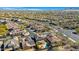 Aerial perspective of a residential area, highlighting homes and a private pool at 40308 N High Noon Way, Phoenix, AZ 85086