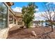 Landscaped backyard with a patio and lake view at 42493 W Candyland Pl, Maricopa, AZ 85138