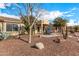 Landscaped backyard with patio and seating area at 42493 W Candyland Pl, Maricopa, AZ 85138