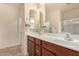 Bathroom with double sinks and mirrored medicine cabinet at 42493 W Candyland Pl, Maricopa, AZ 85138