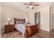 Bedroom with wood flooring, ceiling fan, and wood furniture at 42493 W Candyland Pl, Maricopa, AZ 85138