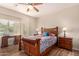Bedroom with a wood bed frame and nightstands at 42493 W Candyland Pl, Maricopa, AZ 85138