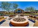 Fire pit and seating area near community center at 42493 W Candyland Pl, Maricopa, AZ 85138