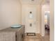 Light entryway with a white door and wood-toned console table at 42493 W Candyland Pl, Maricopa, AZ 85138