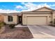 Single-story house with a two-car garage and desert landscaping at 42493 W Candyland Pl, Maricopa, AZ 85138