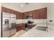 Kitchen with stainless steel appliances and granite countertops at 42493 W Candyland Pl, Maricopa, AZ 85138