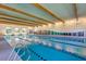 Indoor lap pool with spacious design at 42493 W Candyland Pl, Maricopa, AZ 85138