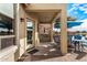 Covered patio with seating area and built-in grill at 42493 W Candyland Pl, Maricopa, AZ 85138