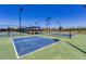 Well-lit outdoor pickleball courts at 42493 W Candyland Pl, Maricopa, AZ 85138