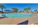 Spacious pool with a pergola and palm trees at 42493 W Candyland Pl, Maricopa, AZ 85138