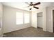 Spacious bedroom with ceiling fan and walk-in closet at 4380 E Renee Dr, Phoenix, AZ 85050