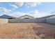 An expansive backyard with a blank canvas awaiting your personal touch and landscaping ideas at 46941 W Old Timer Rd, Maricopa, AZ 85139