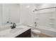 Clean bathroom with a vanity, toilet, and a shower-tub combo at 46941 W Old Timer Rd, Maricopa, AZ 85139