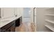 Modern bathroom featuring a double sink vanity, walk-in closet, and glass shower at 46941 W Old Timer Rd, Maricopa, AZ 85139
