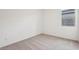 Bedroom with neutral carpet, white walls, and a window at 46941 W Old Timer Rd, Maricopa, AZ 85139