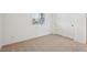 Bedroom with closet, neutral carpet, white walls, and a window at 46941 W Old Timer Rd, Maricopa, AZ 85139