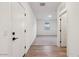 Entryway with tiled floors leading to bedroom with neutral carpet at 46941 W Old Timer Rd, Maricopa, AZ 85139