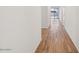 Bright hallway showcasing stylish wood-look tile flooring and neutral wall paint at 46941 W Old Timer Rd, Maricopa, AZ 85139