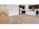 Open-concept living space featuring a modern kitchen with an island and stainless steel appliances at 46941 W Old Timer Rd, Maricopa, AZ 85139
