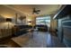Bright living room with city views, fireplace, and hardwood floors at 4909 N Woodmere Fairway -- # 2003, Scottsdale, AZ 85251