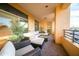 Enjoy outdoor living with this stylish patio featuring modern furniture and lovely plants at 4909 N Woodmere Fairway -- # 2003, Scottsdale, AZ 85251
