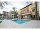 Sparkling community pool features clear water, ample lounge seating, and manicured landscaping at 4909 N Woodmere Fairway -- # 2003, Scottsdale, AZ 85251