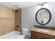 Well-lit bathroom features a granite countertop, tub, shower, and neutral wall color at 5102 E Charleston Ave, Scottsdale, AZ 85254