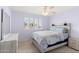 Bedroom with neutral walls, carpeted floors, ceiling fan, and window with wood shutters at 5102 E Charleston Ave, Scottsdale, AZ 85254