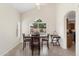 Dining area with a table, chairs, vaulted ceilings, and a view of the backyard pool at 5102 E Charleston Ave, Scottsdale, AZ 85254