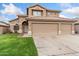 Charming two-story home with a three-car garage and well-maintained lawn in a suburban neighborhood at 5102 E Charleston Ave, Scottsdale, AZ 85254