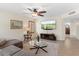 Cozy living room with a ceiling fan, large TV, comfortable sectional sofa, and neutral tones at 5102 E Charleston Ave, Scottsdale, AZ 85254
