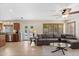 Inviting living room with a comfortable sofa, a ceiling fan, and access to the backyard pool area at 5102 E Charleston Ave, Scottsdale, AZ 85254