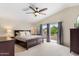 Spacious main bedroom with a vaulted ceiling, balcony access, and ample natural light at 5102 E Charleston Ave, Scottsdale, AZ 85254