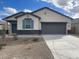 New single-story home with gray exterior and teal shutters at 641 W Freedom St, Florence, AZ 85132