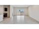 Spacious living room with tile flooring and sliding glass doors to backyard at 641 W Freedom St, Florence, AZ 85132