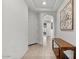 Bright entryway with tile flooring and a wooden console table at 6465 W Millerton Ct, Florence, AZ 85132