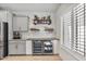 Kitchen wet bar with wine cooler and shelving at 6465 W Millerton Ct, Florence, AZ 85132