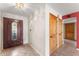 Entryway with tile floors, wood doors, and an adjacent living area at 7319 E Rose Ln, Scottsdale, AZ 85250